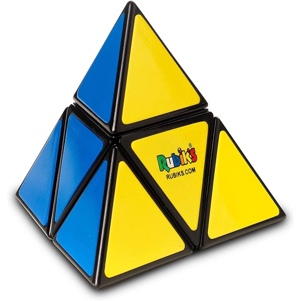 Image of the puzzle outside of the packaging. It is very different from the original Rubik's cube. It has four faces; blue, yellow, red, and green, and only four triangle sections per face of the pyramid.