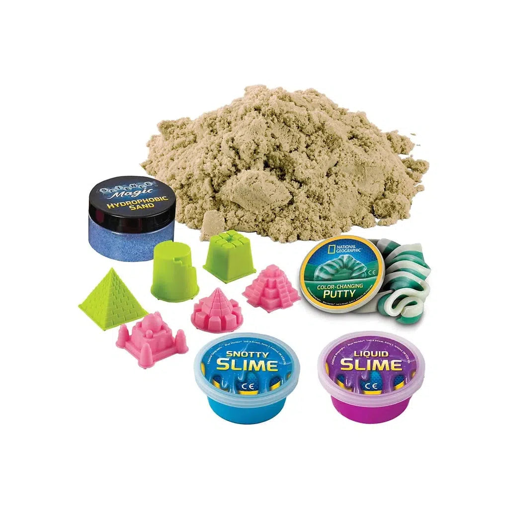 this image shows the sands, hydrophobic sand, slime, putty and toys to build small sand castles with included in the box. 