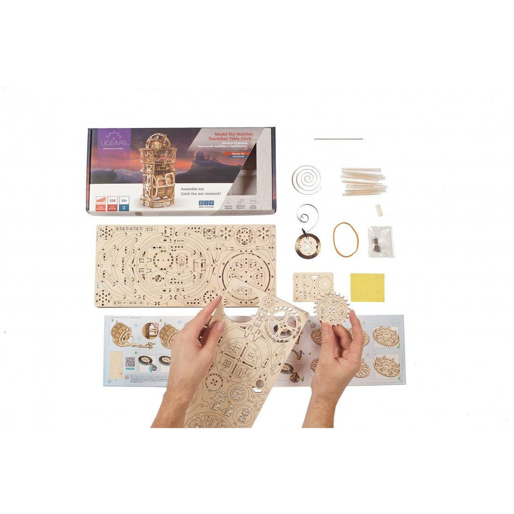 Full contents and packaging of kit | Includes but is not limited to: wooden sheets of model pieces, dowls, wire, and more. 