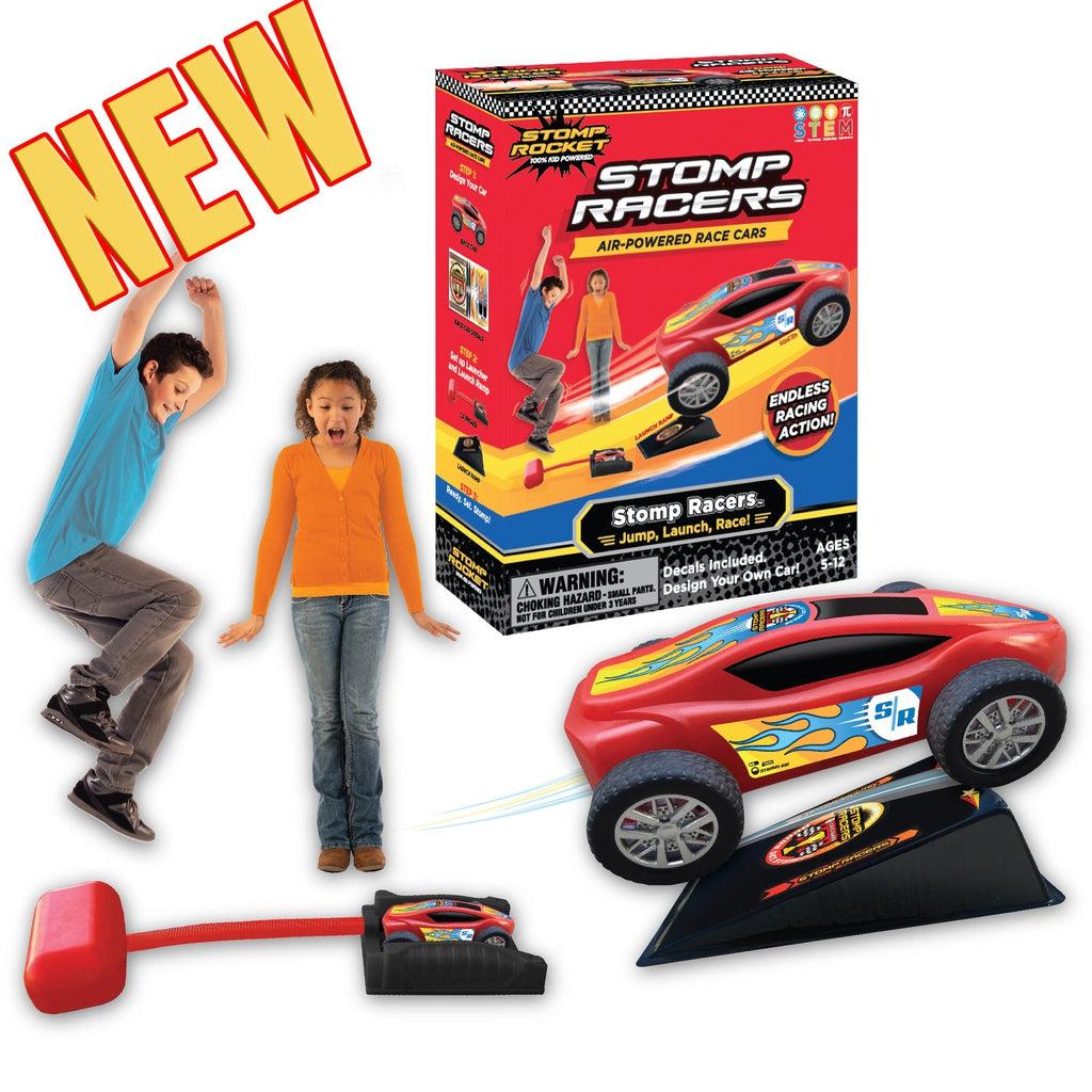 A kid is shown jumping on the stomp pad to launch the car. There is an enlarged version of the car driving off a ramp, and an enlarged version of the box with the word: NEW to the left of it.