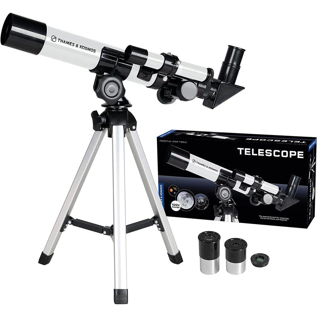 Telescope and eyepieces out of packaging | Packaging off to side. | Telescope is white with black details and a metallic aluminum stand.