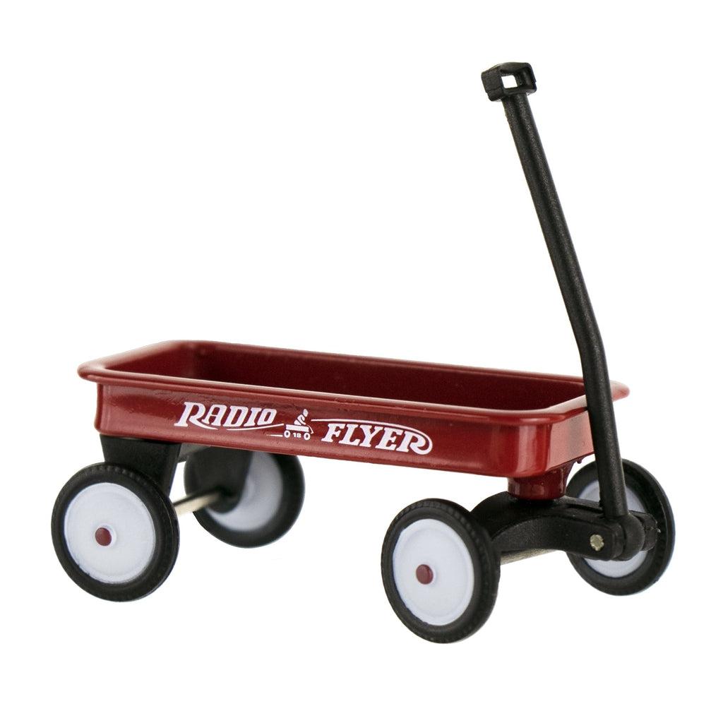 Close up image of the Radio Flyer wagon. It has immaculate detail on the wheels and the logo on its side.