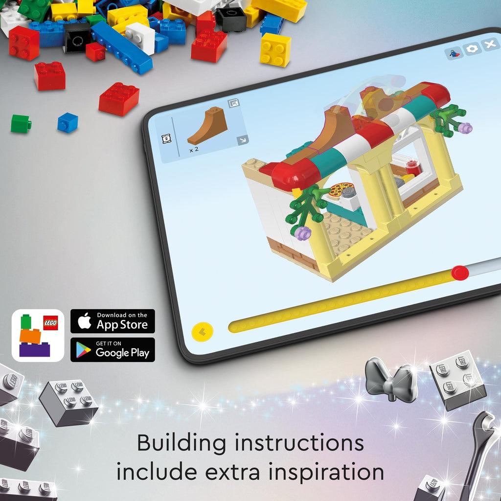 Lego builder app shown on an ipad displaying instructions in a 3d view | Text reads: Building instructions include extra inspirations