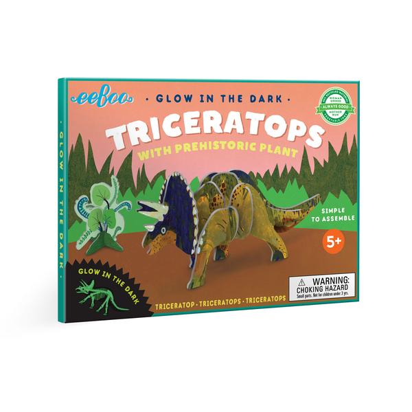 glow in the dark triceratops model with prehistoric plant. 