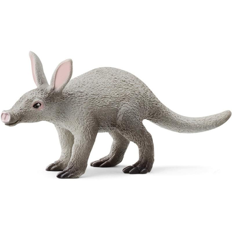 Image of the Aardvark figurine. It is light grey with darker feet. The inside of its ears and its nose is light pink.
