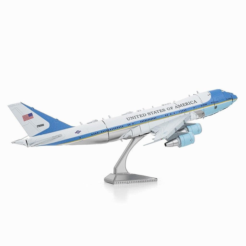 image shows a model silver and blue model airplane