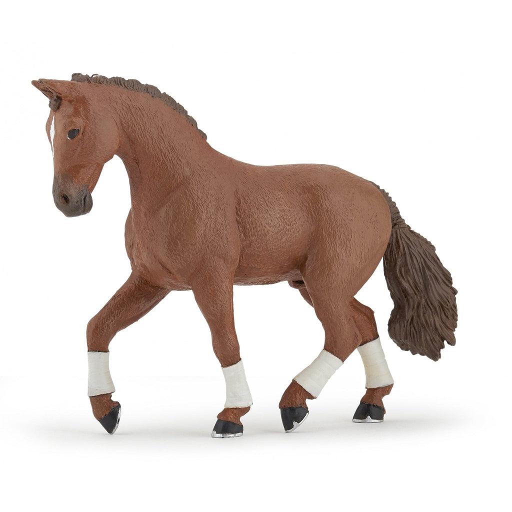 Image of the Alezan Hanovrian Horse figurine. It is a brown horse with white legs and a darker brown mane and tail.