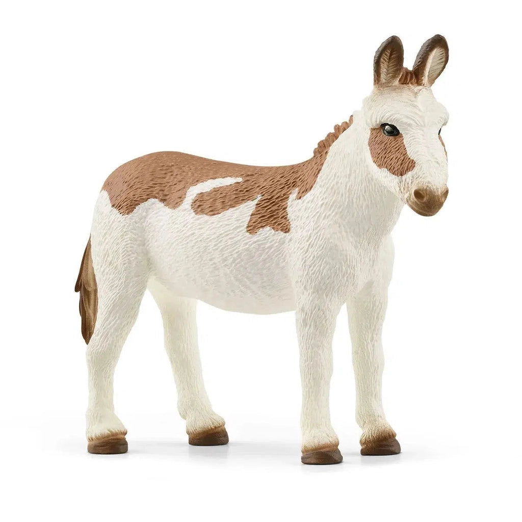Image of the American Spotted Donkey figurine. It is a mainly white animal with light brown spots, mane, and tail.