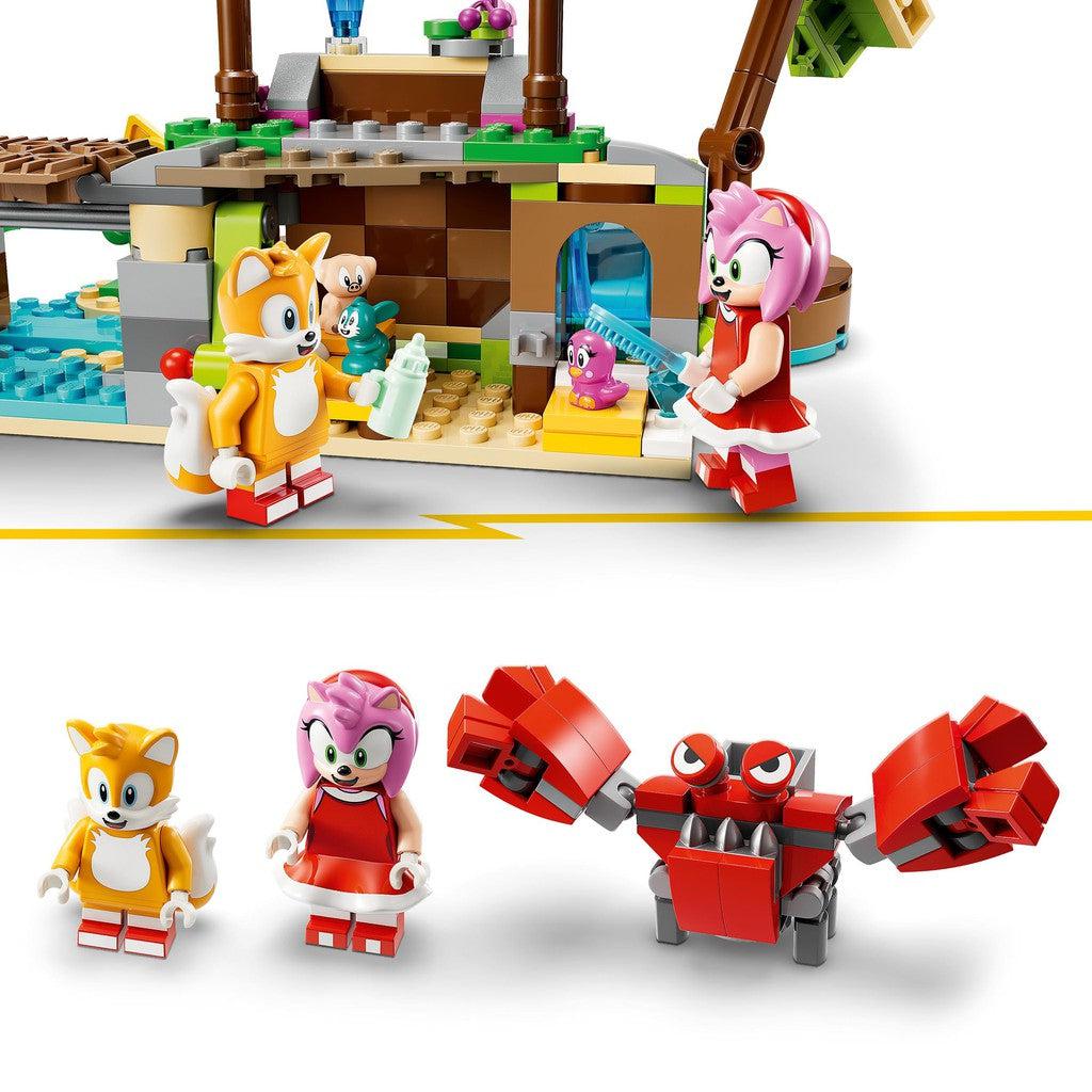 image shows tails and amy taking care of the animals on the rescue island