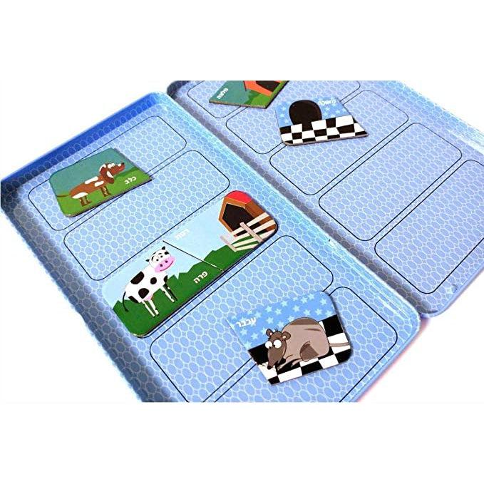Image of the inside of the game tin. On both sides are rounded rectangles designed to line up the animal and homes puzzle pieces.