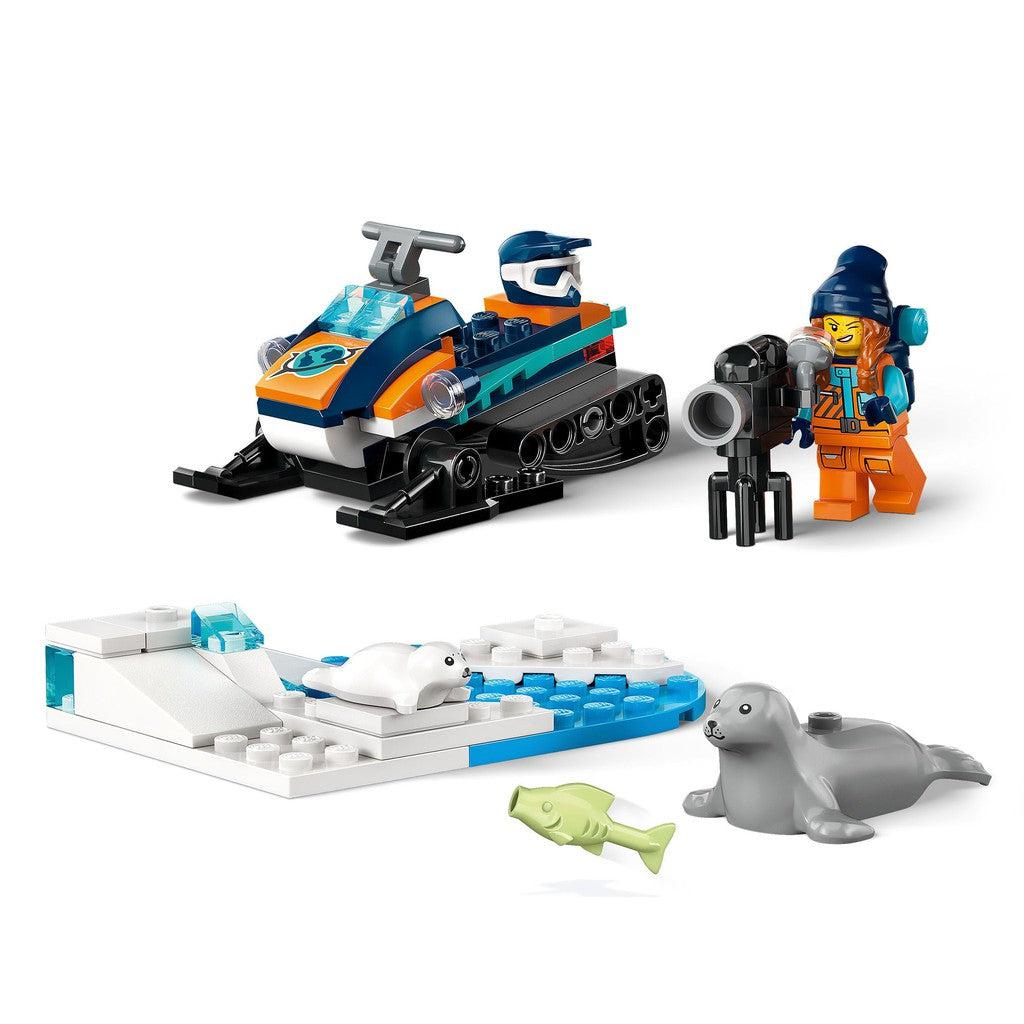 image shows a cameral, snow mobile, and a platform of LEGO ice and water for the seals to play