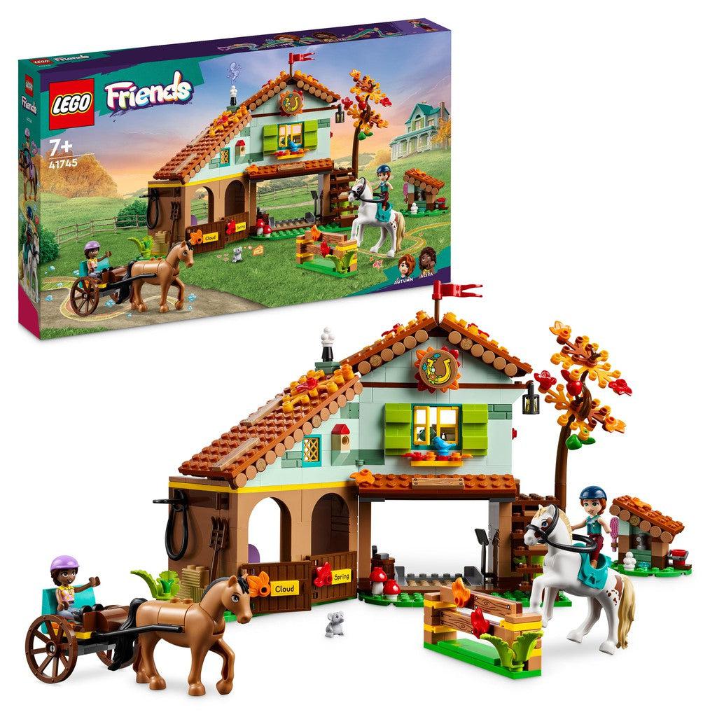 image shows LEGO Friends Autumns Horse Stable where there are two horses and two girls riding teh horses around a stable building