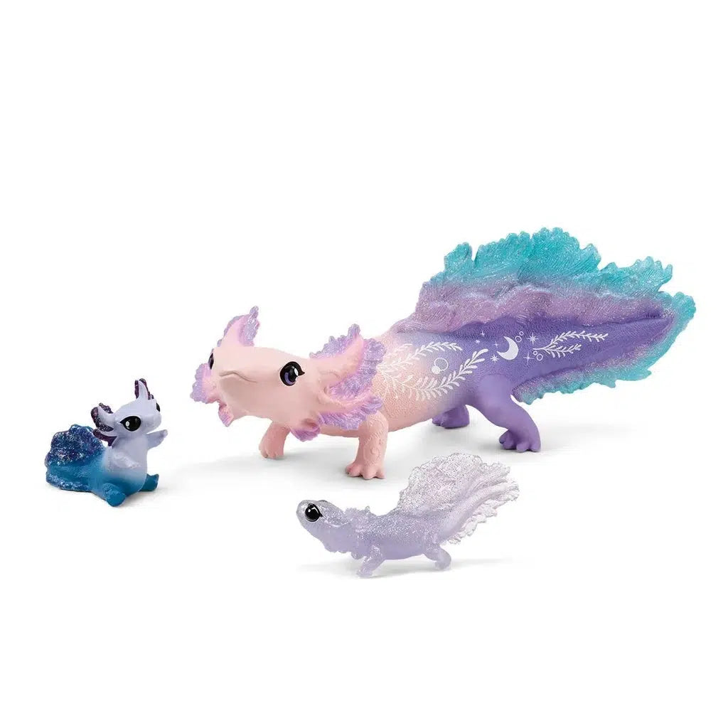 Image of the Axolotl Discovery figurine set. It comes with three different axolotls, one large pink, purple and blue one, one small glittery clear one, and one small one of multiple shades of blue. This small blue axolotl is in a sitting position while the others are all standing on all four legs.