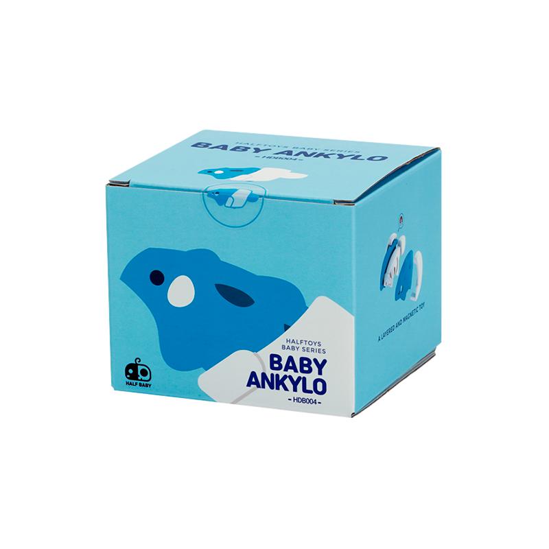 Image of the packaging for the Baby Ankylo and Crib figurine toy. It is a light blue cube with a 2D picture of the figurine on the side.
