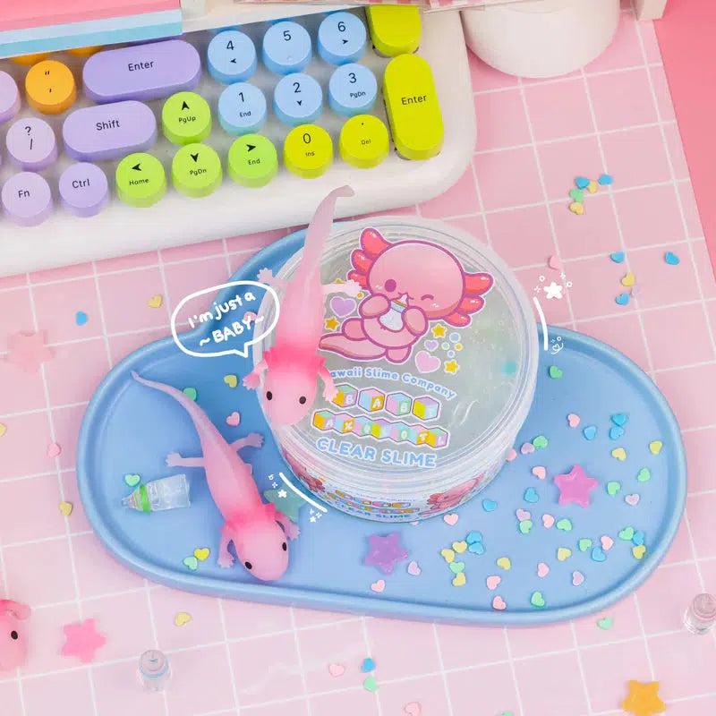 the top of the case has a cute art of an axolotl drinking from a baby battle, saying "im just a baby"
