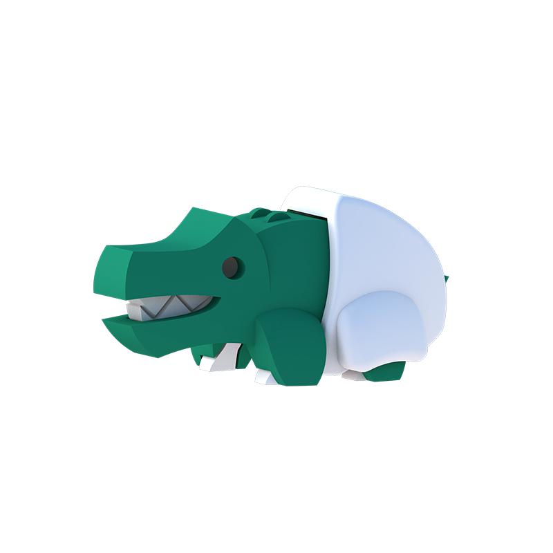 Image of baby crocodile figurine outside of the packaging. It is a dark green crocodile wearing a white diaper and showing sharp teeth.
