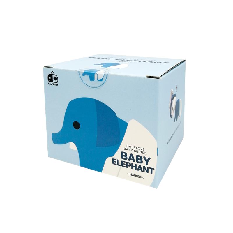 Image of the packaging for the Baby Elephant and Crib figurine toy. It is a light blue cube box with a 2D picture of the figurine on the side.
