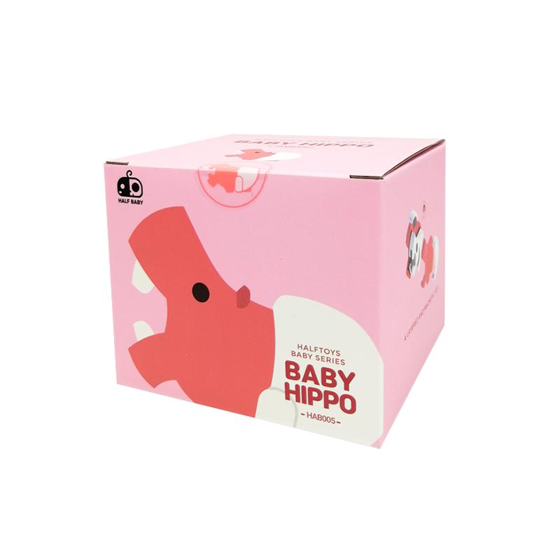 Image of the packaging for the Baby Hippo and Crib figurine. It comes in a pink box with a 2D picture of the figurine.