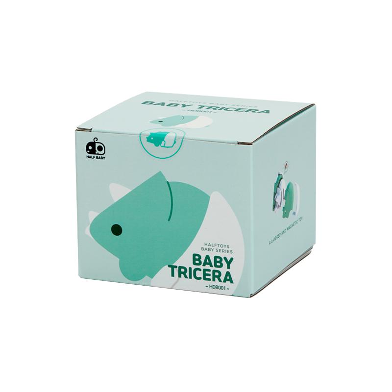 Image of the packaging for the Baby Tricera and Crib figurine toy. It comes in a light mint cube box with a 2D picture of the included figurine on the side.