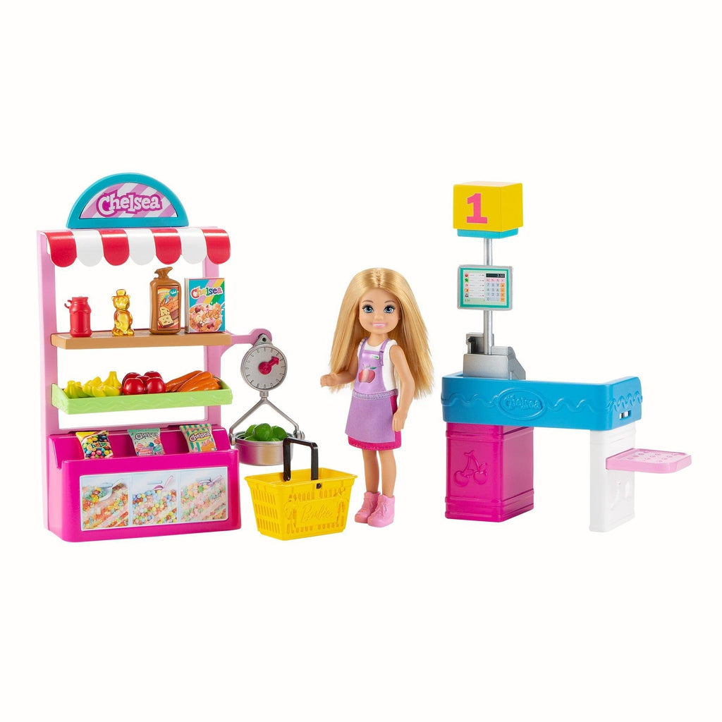 Image of the playset outside of the packaging. It includes a snack stand with snacks, a Chelsea doll, a shopping basket, and a checkout counter.