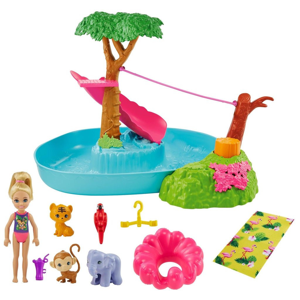 Image of all the included set pieces in Barbie - Chelsea The Lost Birthday Splashtastic Pool Surprise. It includes a pool with slide and zipline, Chelsea in a bathing suit, a pool floatie, a towel, a baby tiger, baby monkey, parrot, and baby elephant.
