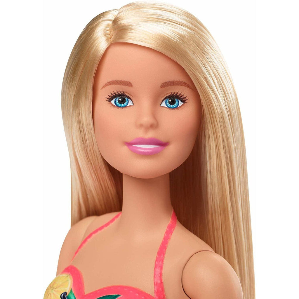 Up close shot of Barbie's face. This Barbie comes with straight long blonde hair and blue eyes.