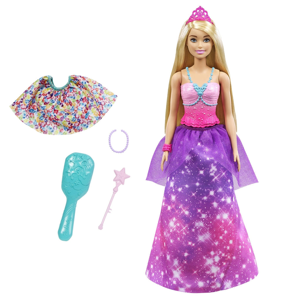 Image of Barbie outside of the packaging. Her set includes a crown, two skirts, a brush, a necklace, and a magic wand.
