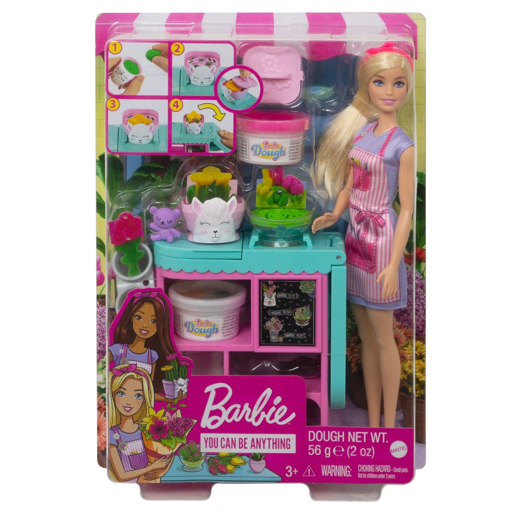 Image of the packaging for the Barbie Florist Doll Playset. The front is made from clear plastic so you can see all the included parts inside.