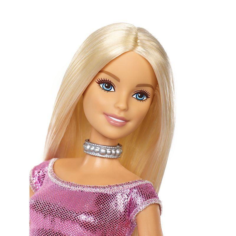 Up close shot of Barbie's face. This barbie comes with straight blonde hair. The painting of her face is very detailed.