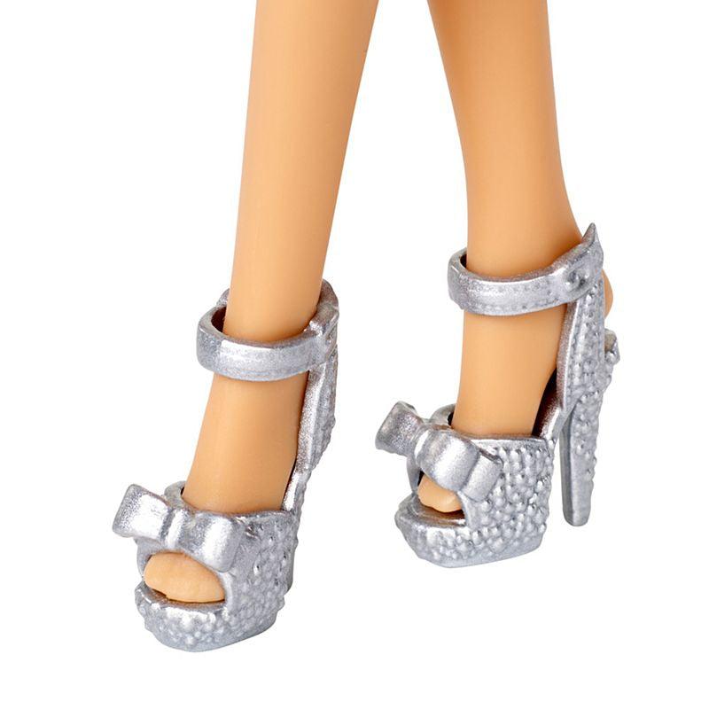 Up close shot of Barbie's shoes. The high heels are stilettos and they have a bow on the front of them 