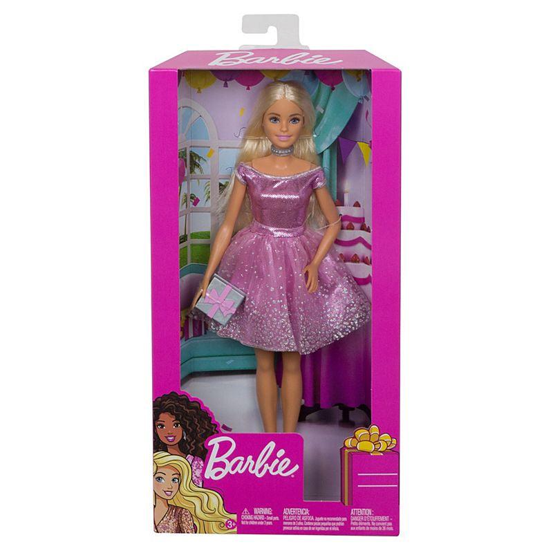 Image of the packaging for Barbie Happy Birthday Doll. The front is made from clear plastic so you can see the doll inside.