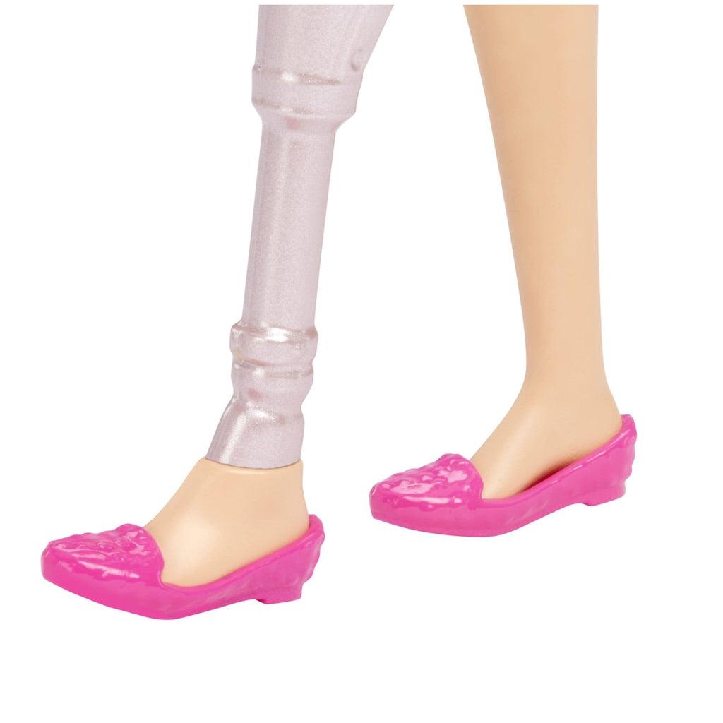 Up close image of Barbie's prosthetic leg. It is silver and it goes from her foot to her thigh.