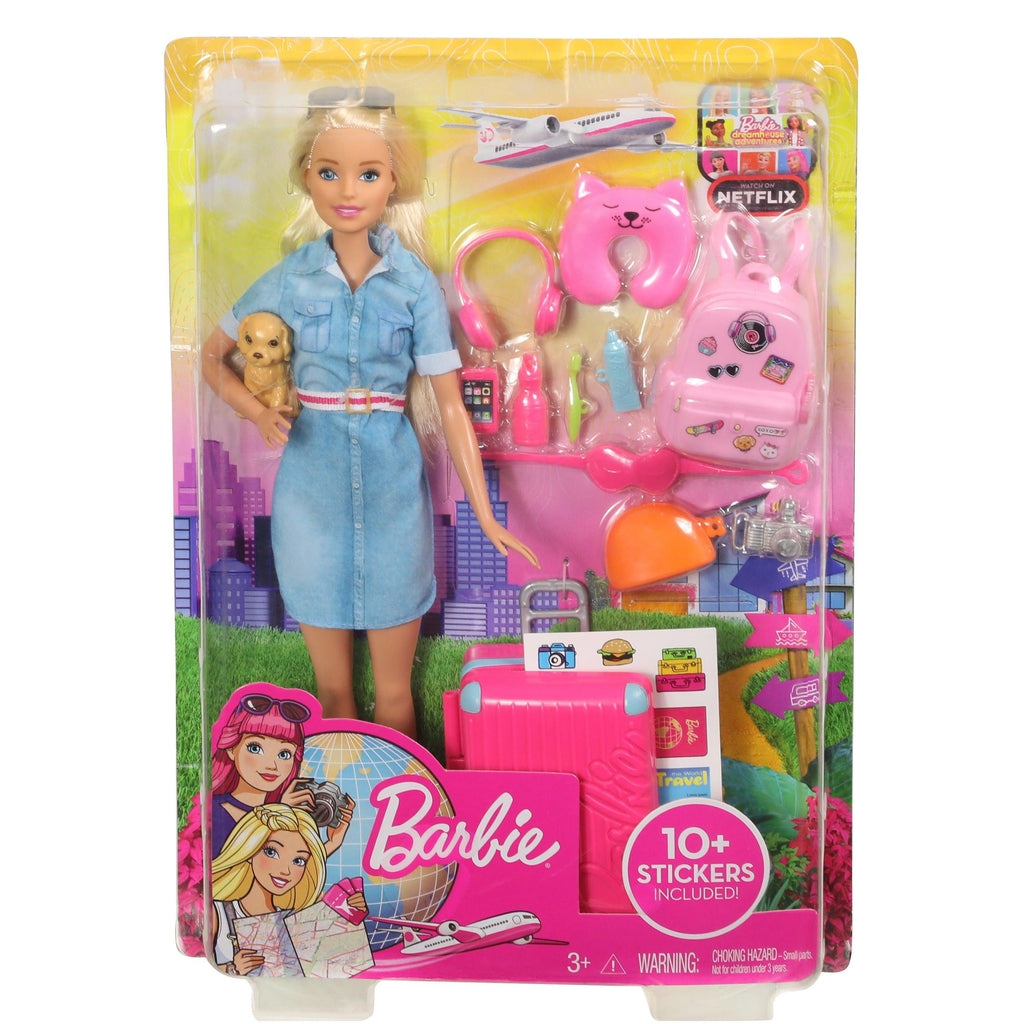 Image of the packaging for the Barbie Travel Doll. The front is made from clear plastic so you can see the doll and all the included pieces inside.
