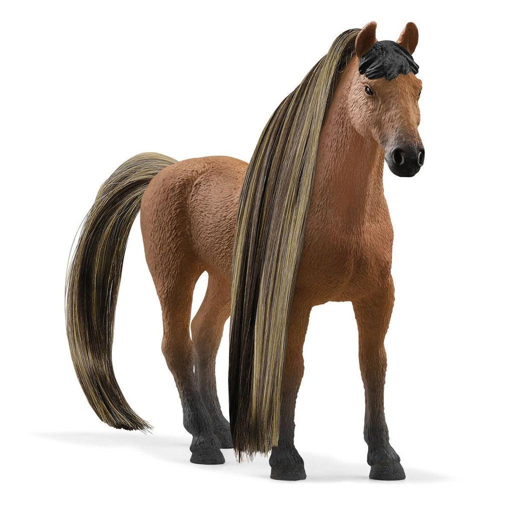 Image of the figurine outside of the packaging. It is a brown horse with long black with blonde highlights hair that can be braided and beaded.