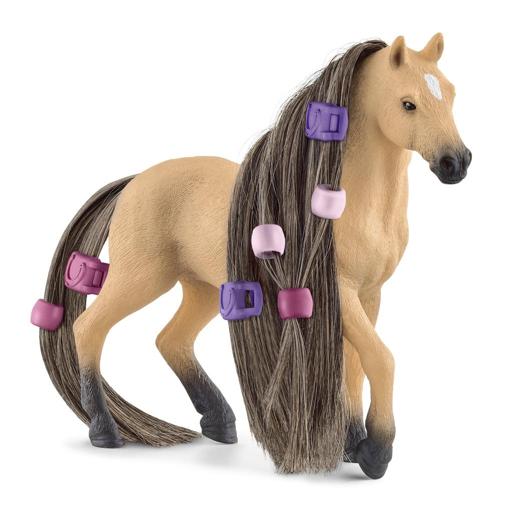 Image of the Beauty Horse Andalusian Mare figurine. The horse is light brown and it has long brown hair that can be braided and beaded. 