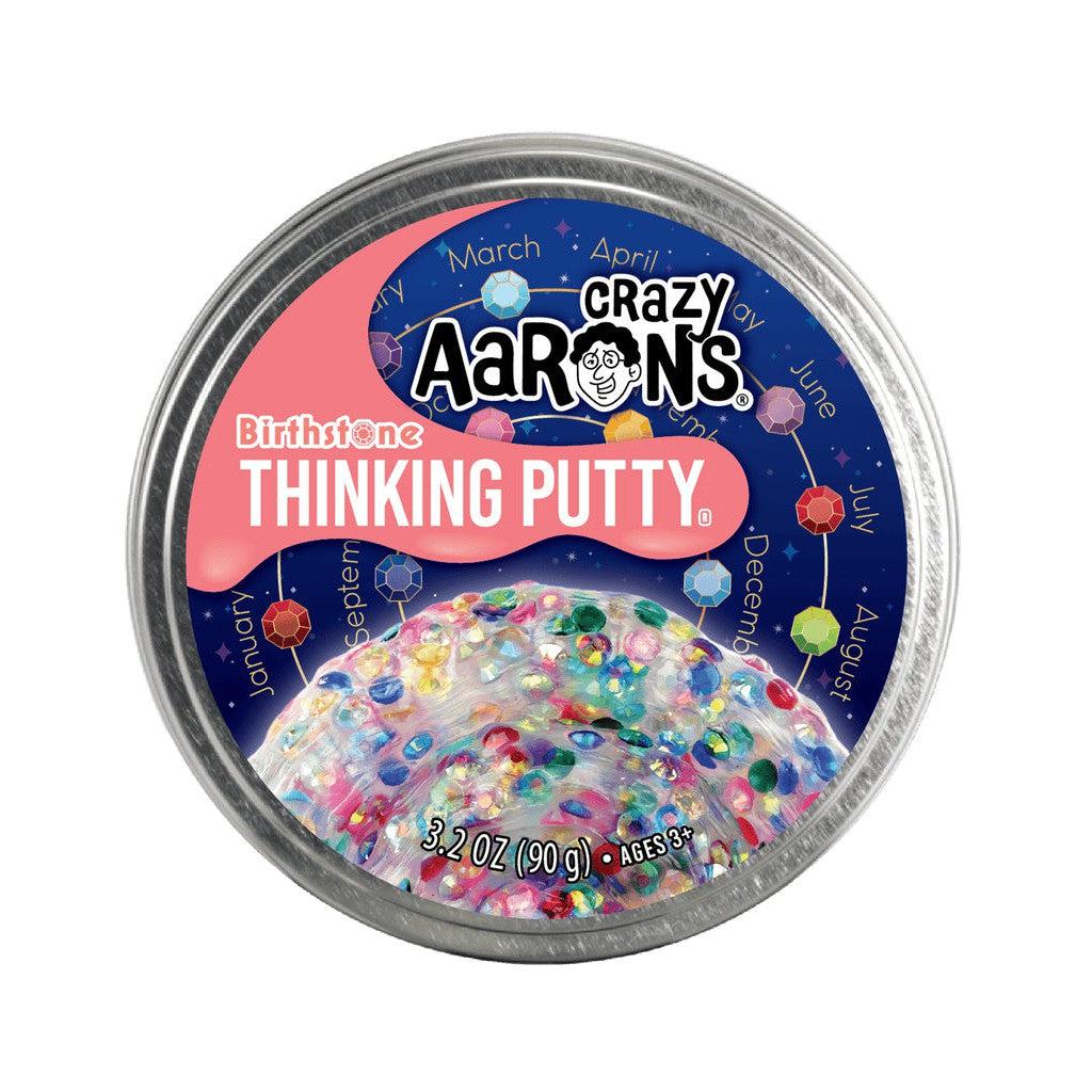 image shows a tin of birthstone thinking putty