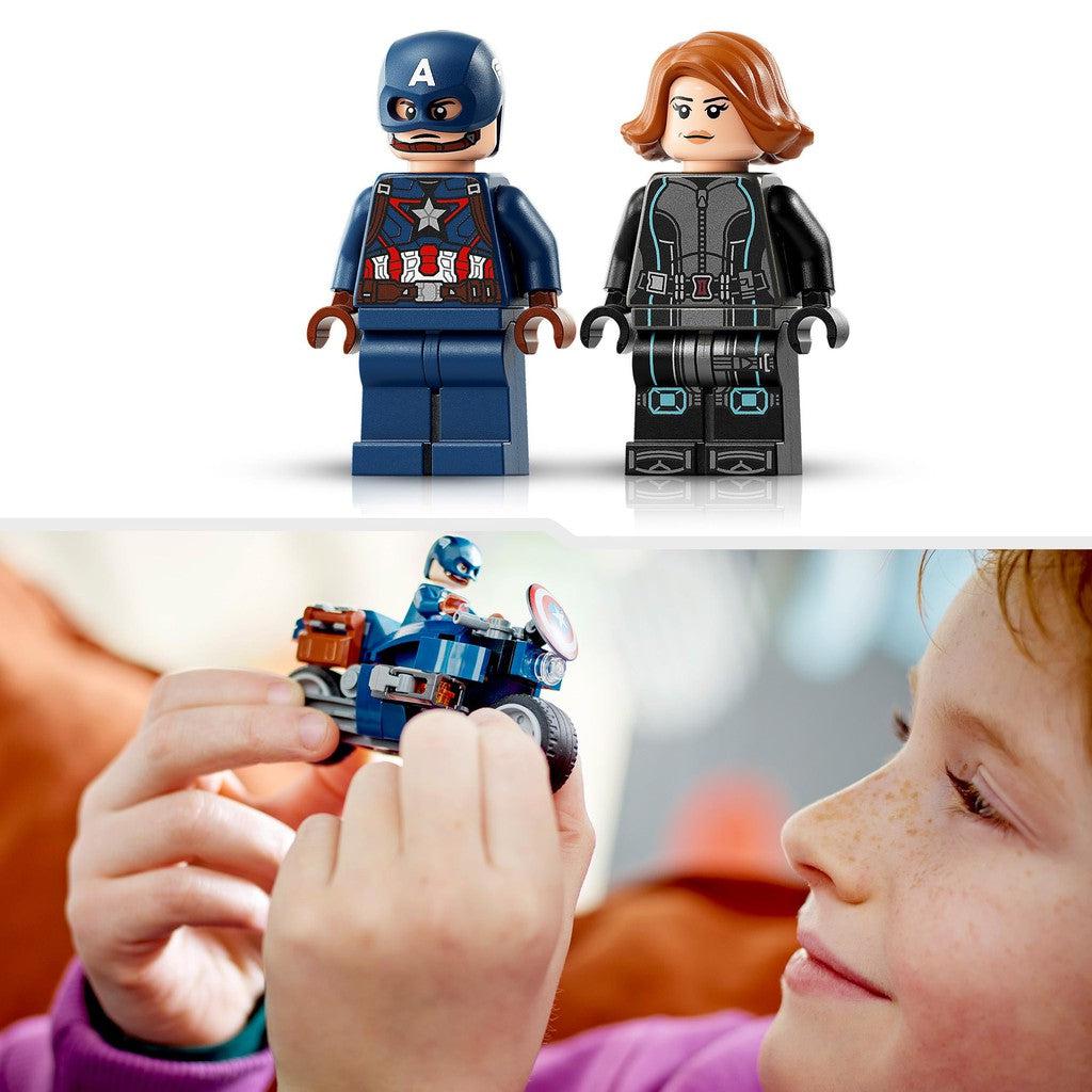image shows a child driving the captain america motorcycle around