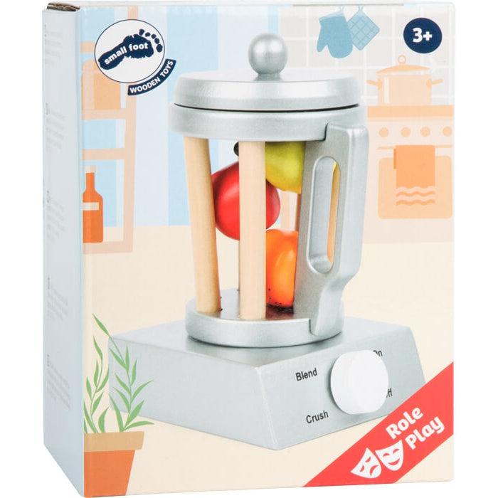 Image of the packaging for the Play Kitchen Wooden Blender. The box has a picture of the blender full of food.