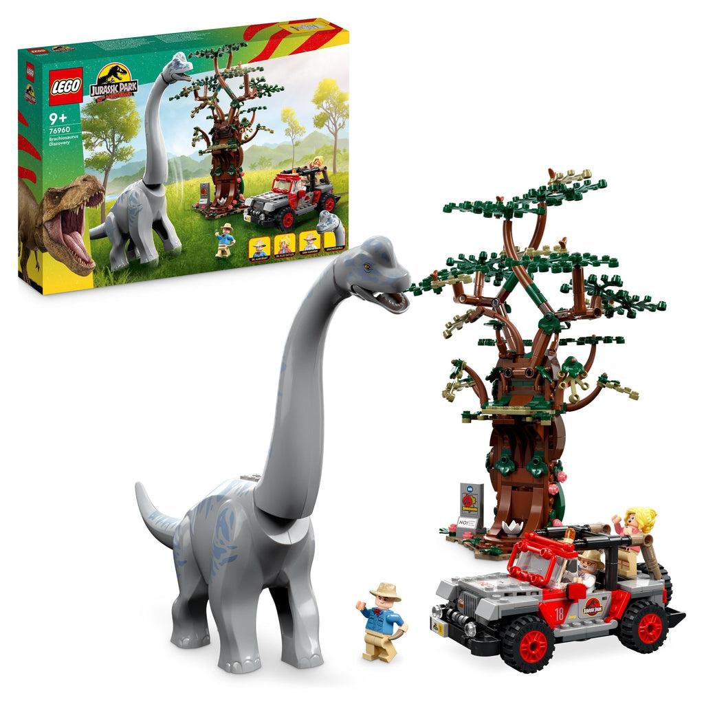 lego set is shown in front of its box, it includes a tall lego tree, a lego brachiosaurus, and 3 minifigs inside a lego jeep