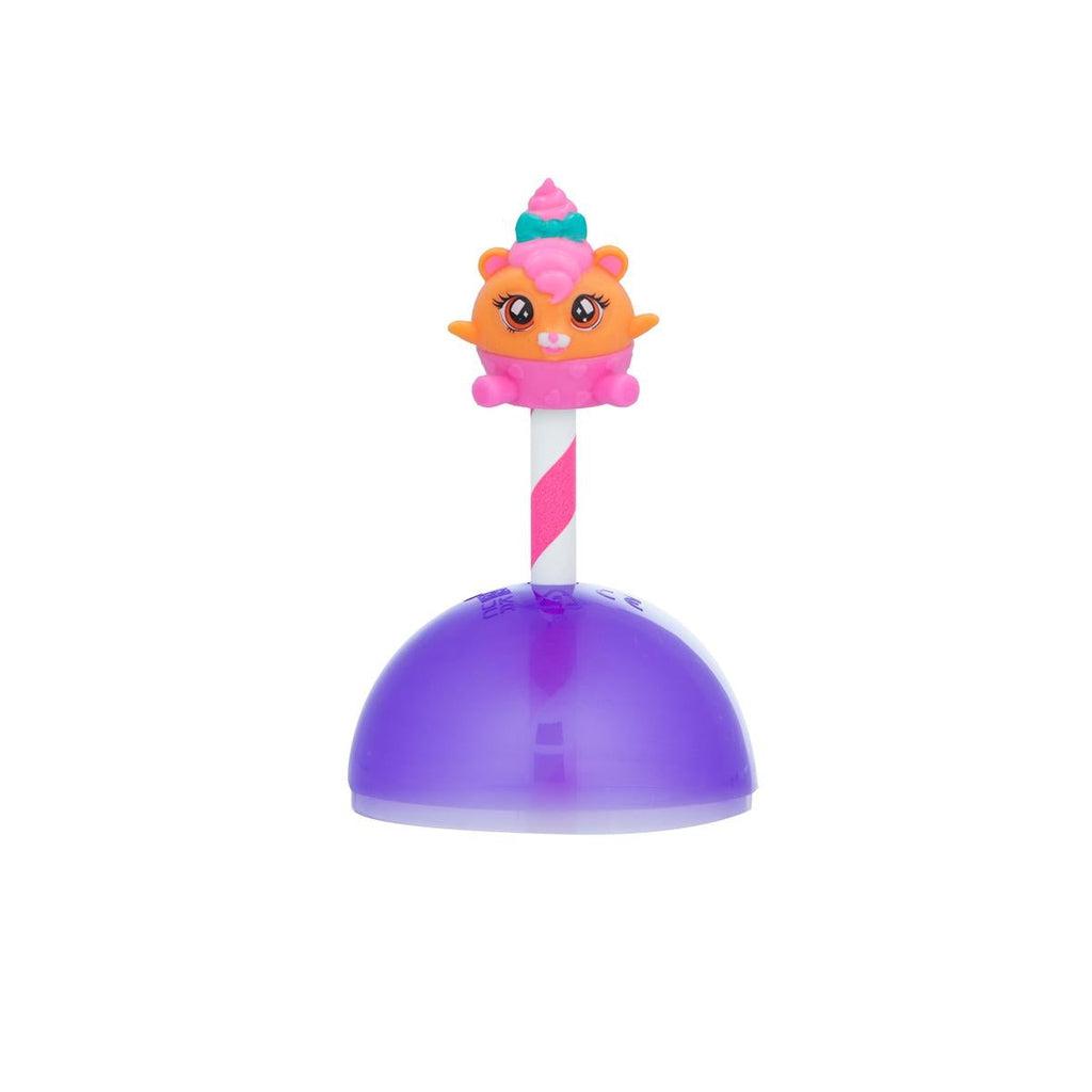 Shows an orange and pink Lil Pop sitting on top of the included straw and half orb.
