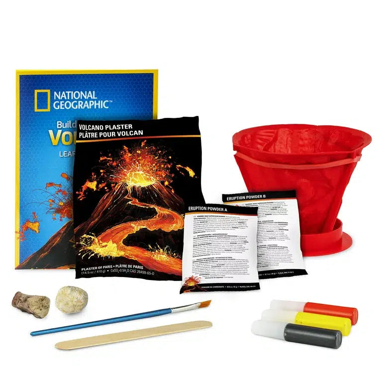 image shows the included items in the boc, eruption poweder a and b, a paint brush and paint, volcanic rucks, plaster, volcano mold and a learning guide by national geographic on volcanos