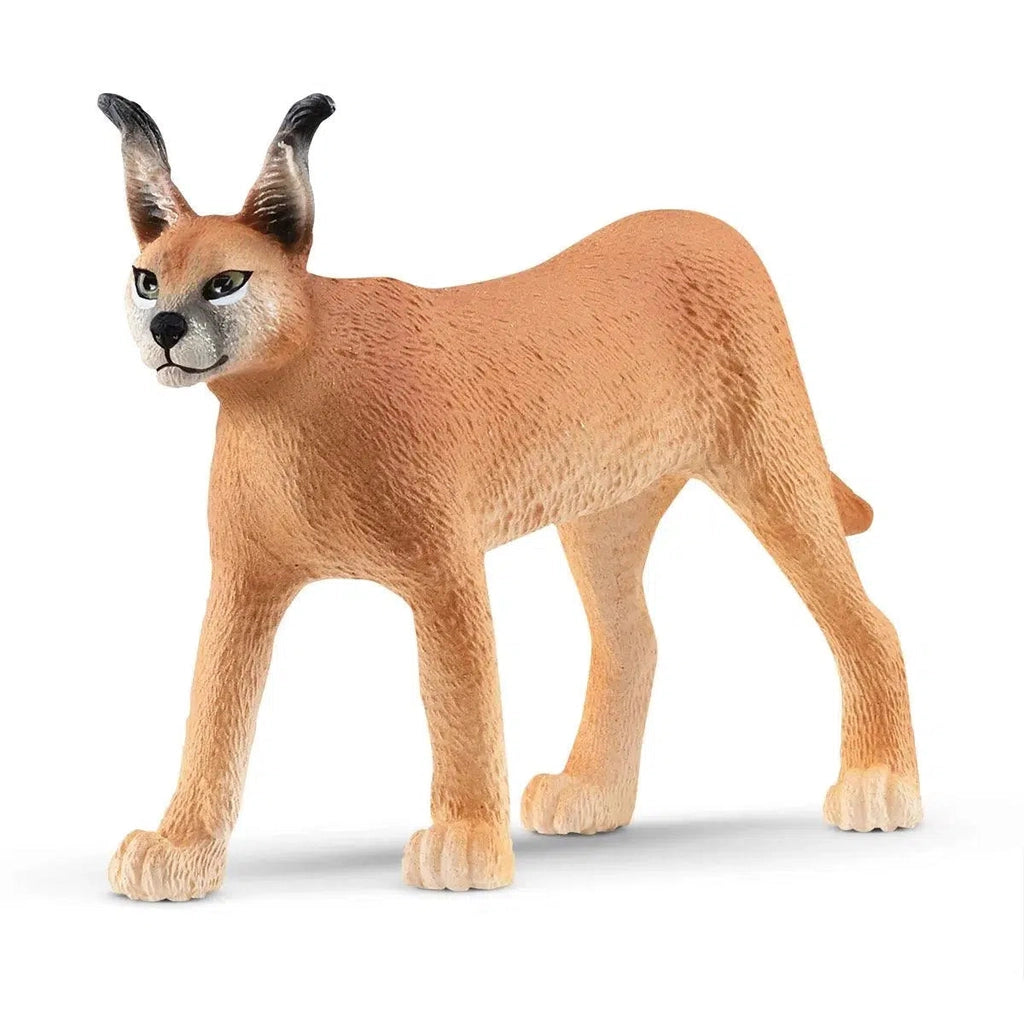 Image of the Caracal Female figurine. It is dark sandstone colored with black tips to its nose and ears.