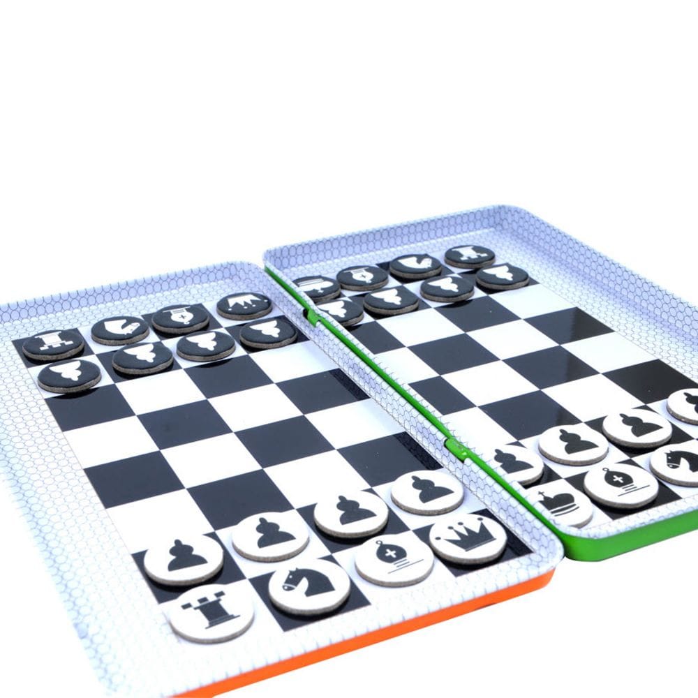 Image of the inside of the game tin. Together, both sides create the chess board and there are magnetic game pieces that can be stored inside.