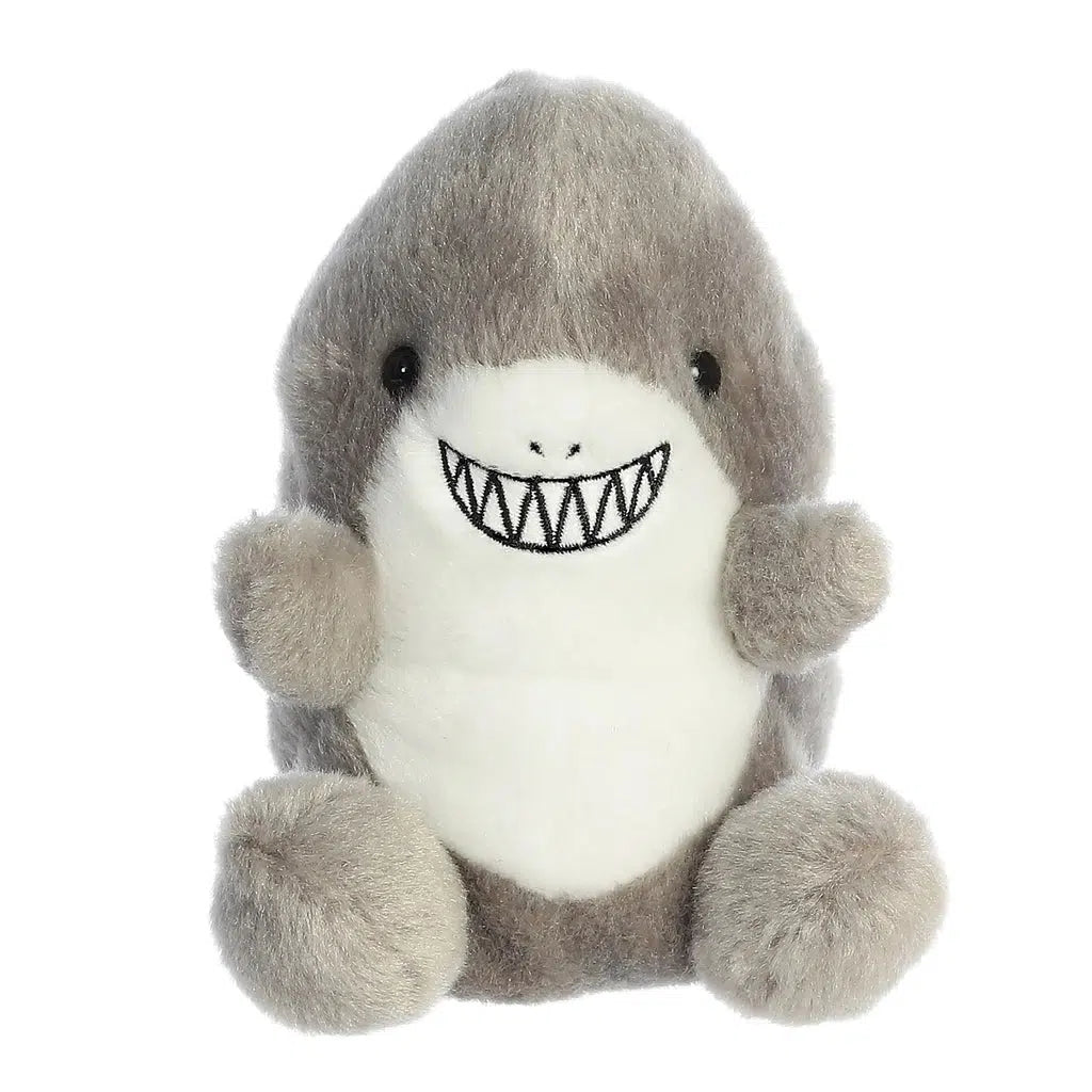 Image of the Chomps Shark plush. It is a grey shark with its arms out as if asking for a hug. He has a wide smile showing sharp teeth.