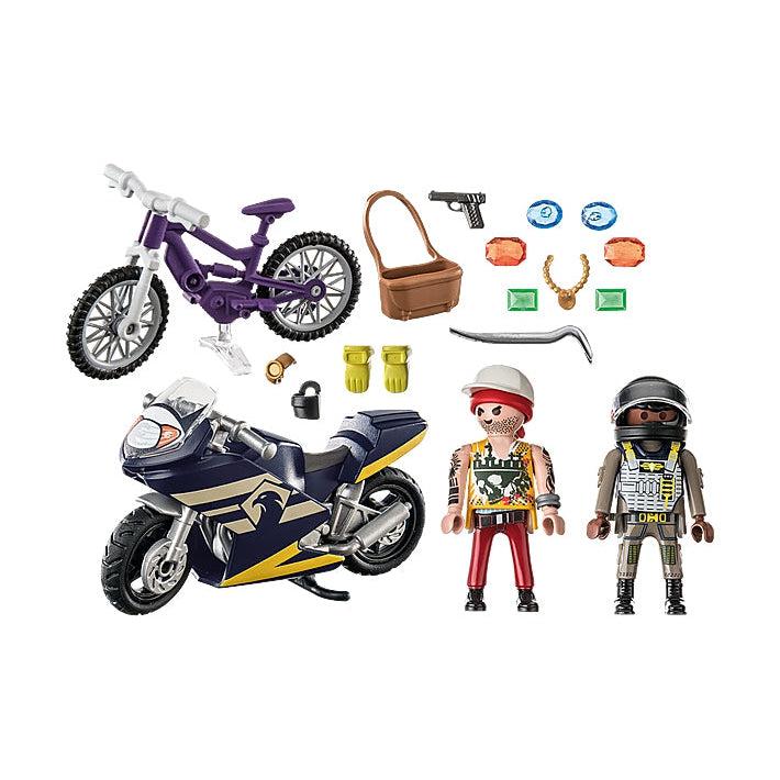 The box inxludes, a bike, mototcycle, thief, special forces, bag with jewels, gloves, and a plastic toy gun