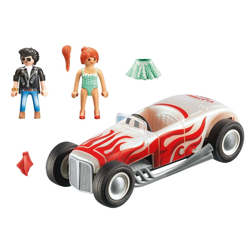This image shows everything in the set, the car, the girl with an attachable ponytail and skirt, the guy, the car that only seats one, and the bag.