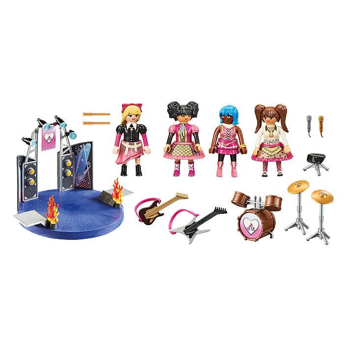 A picture showing the stage, musical instruments of guitar, bass, drums and symbols. There are 4 playmobil dolls that can take the stage and rock on.  
