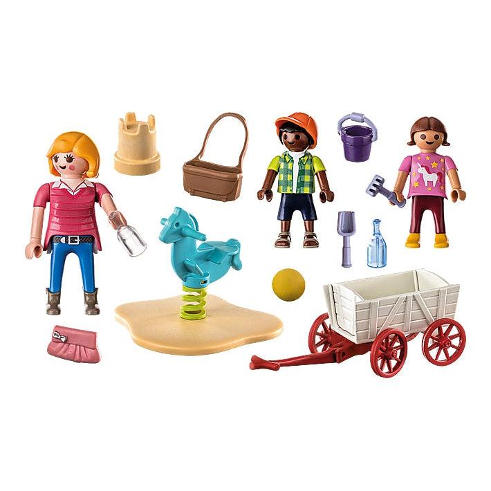 The picture shows the contents of the set, a teacher with a water bottle, Two children, a ball, a sand castle, a wagon, and a pony seesaw