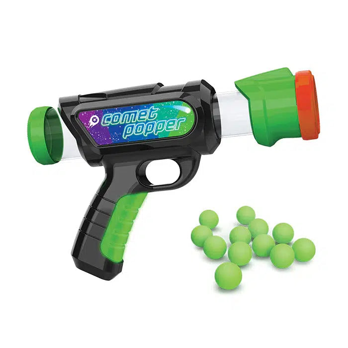 Close up of the Comet Popper. It has a black body with green accents. The name of the toy is on the side of the blaster. The included foam balls are green.