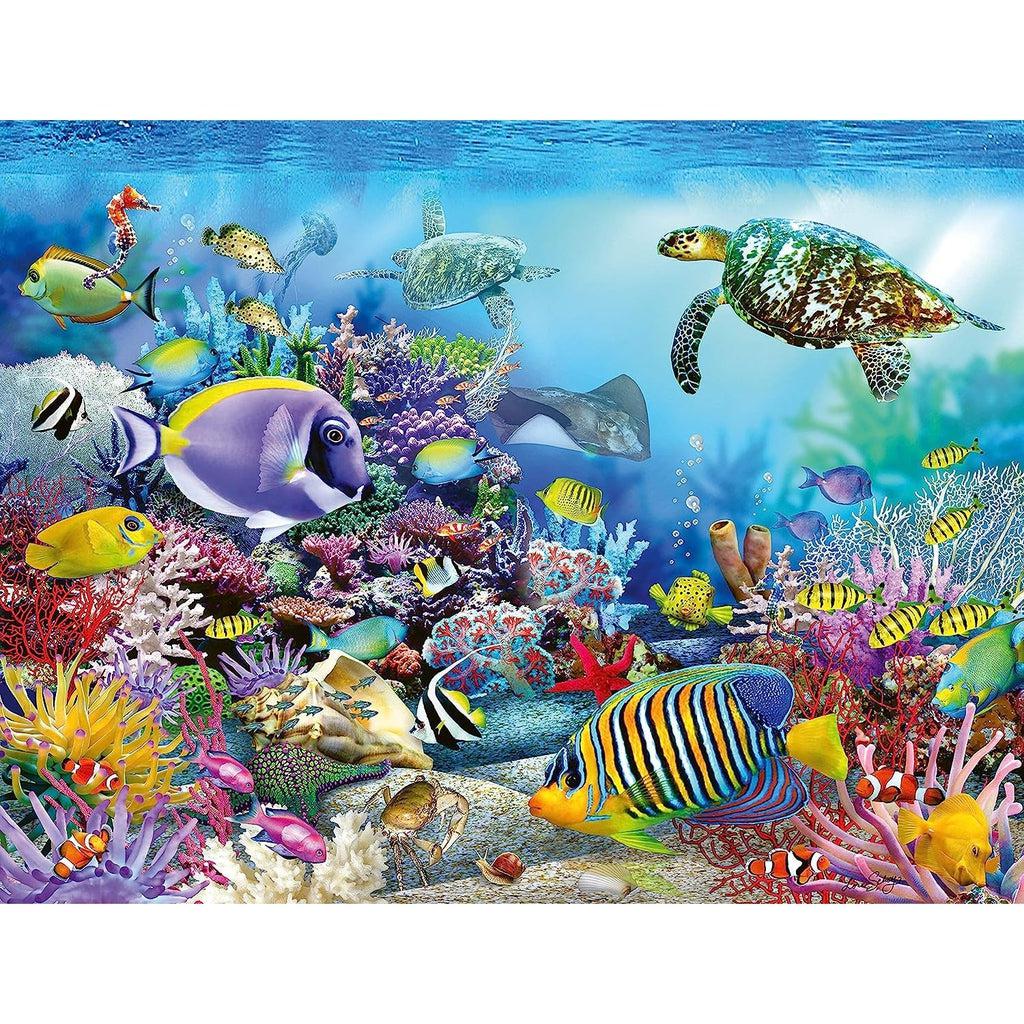 Image of the finished puzzle. It is an underwater scene of a coral reef with lots of tropical fish swimming around.